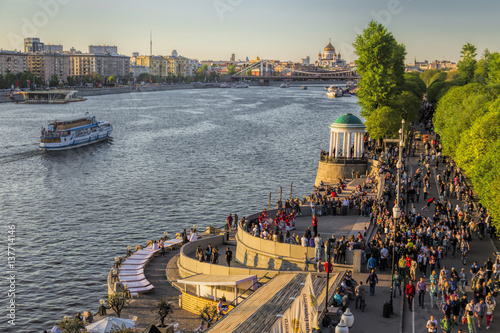 People walking on embankment of the Moscow river