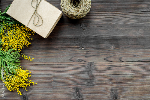 concept International Women Day with flowers wooden background top view