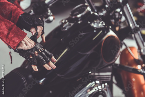 Grandmother wearing accessory near motorcycle © Yakobchuk Olena
