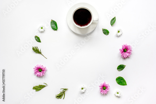 Petals and cup on table background top view mock up