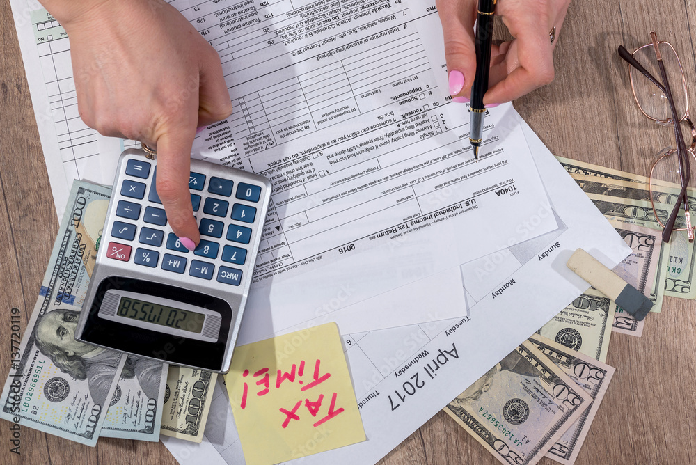 Woman calculate tax. Business woman working with tax documents. dollar, glasses, pen. Woman calculate tax. Business woman working with tax documents. dollar, glasses, pen.