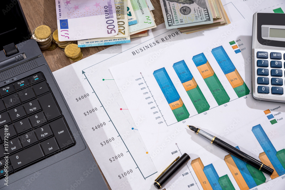 financial concept - business graph, euro, dollar and calculator on desk. financial concept - business graph, euro, dollar and calculator on desk.