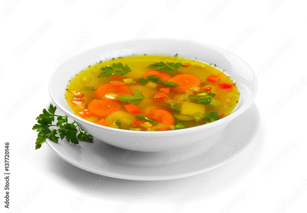 Fresh vegetable soup in plate on white background Fresh vegetable soup in plate on white background