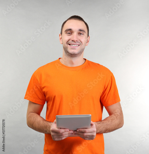 Handsome man with tablet co...
