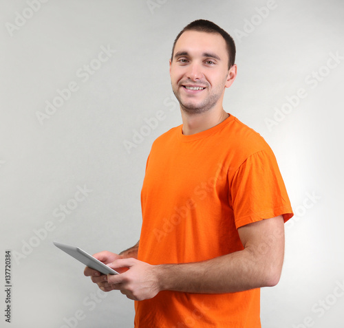 Handsome man with tablet co...