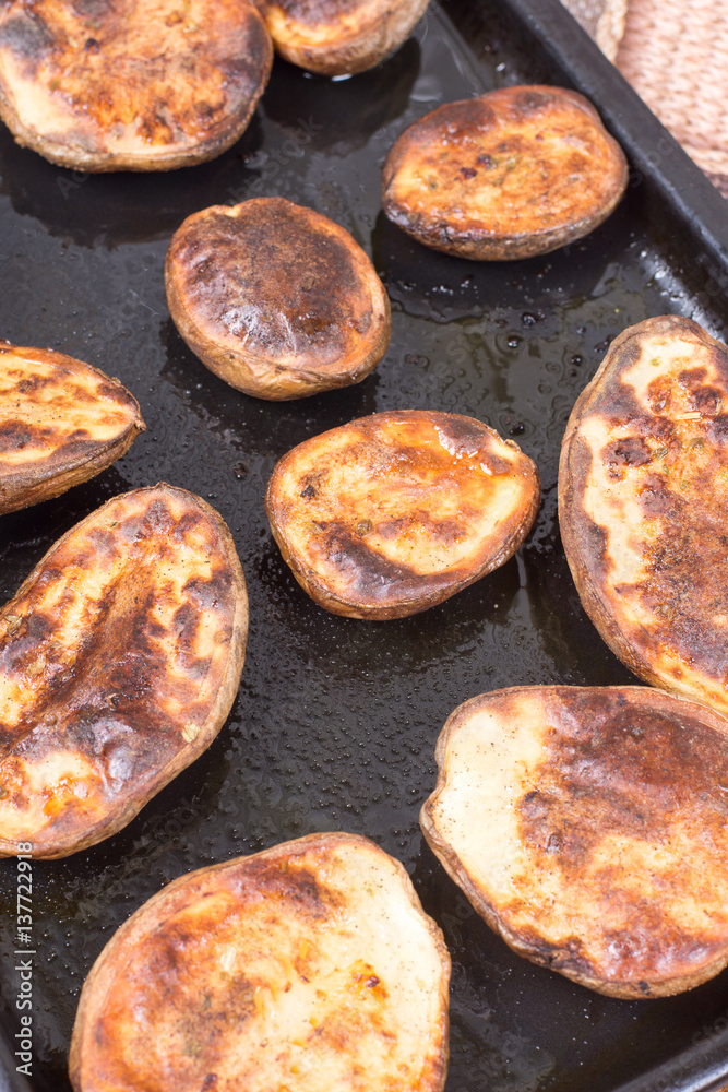 Baked potatoes in the oven with shell Baked potatoes in the oven with shell