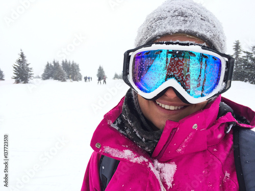 Female skier on skiing terrain- close up