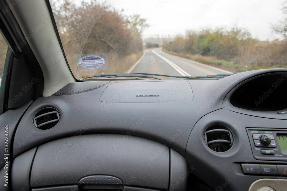 Car interior and road. Passenger view. 