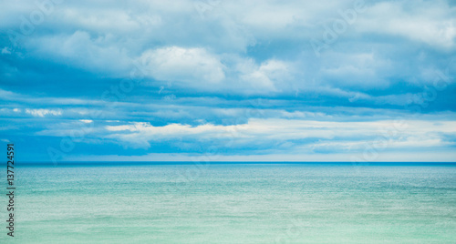 Sea, horizon and clouds in the sky. © Svetlana