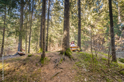 woman talking on mobile phone in forest