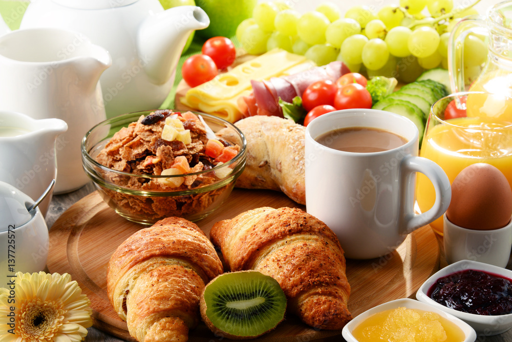 Breakfast served with coffee, orange juice, egg and fruits Breakfast served with coffee, orange juice, egg and fruits
