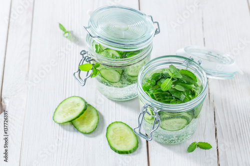 Healthy water in jar with mint and fresh cucumber