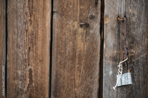 Wallpaper Mural Detail of the old door of the barn with open padlock which hanging on the bracket.  Torontodigital.ca