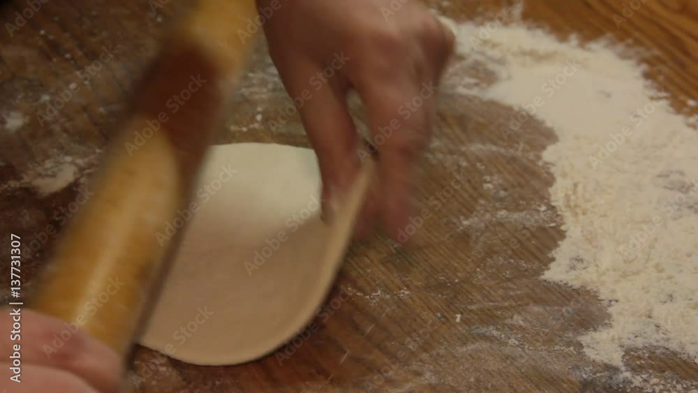 roll out the dough flat with a rolling pin