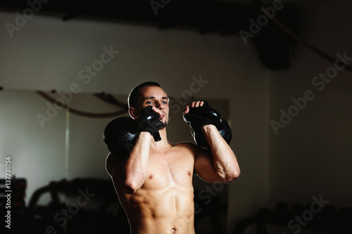 handsome athlete with Kettlebell © shevtsovy