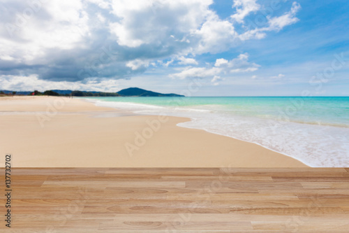 Wood table floor on beach   tropical sea scenery background.