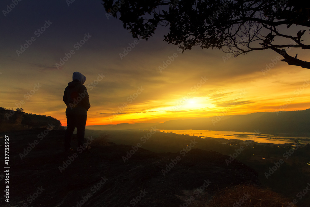  women with looking sunrise alone