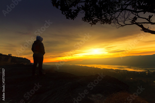  women with looking sunrise alone