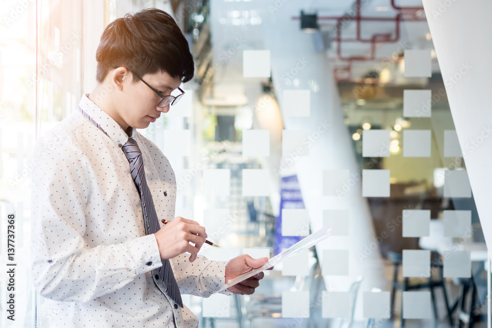 Young businessman reviewing documents conference Working Planning Thinking Ideas Strategy Seriously Concept Young businessman reviewing documents conference Working Planning Thinking Ideas Strategy Seriously Concept