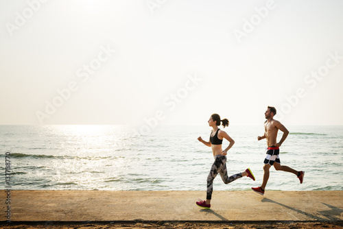 Fototapeta Naklejka Na Ścianę i Meble -  Running Exercise Training Healthy Lifestyle Beach Concept