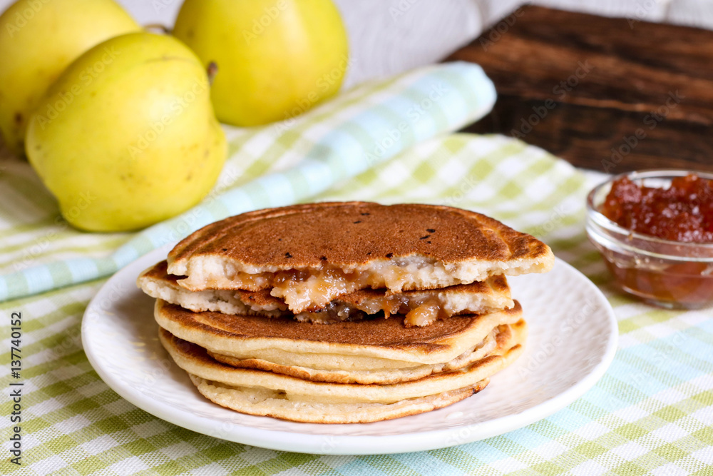 Sweet pancakes made of apple, curd and cinnamon Sweet pancakes made of apple, curd and cinnamon