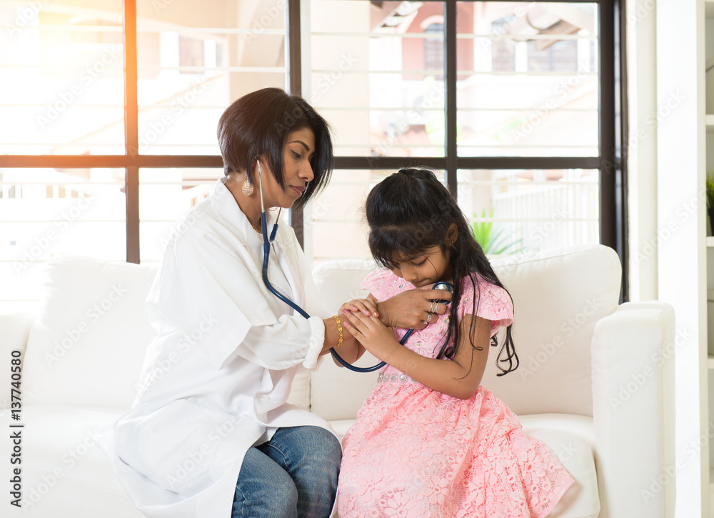 indian female doctor treating young patient Stock Photo | Adobe Stock