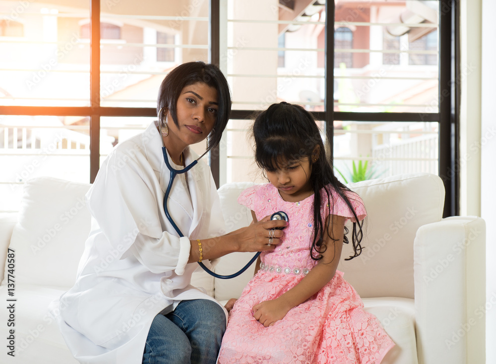 indian female doctor treating young girl patient Stock Photo | Adobe Stock