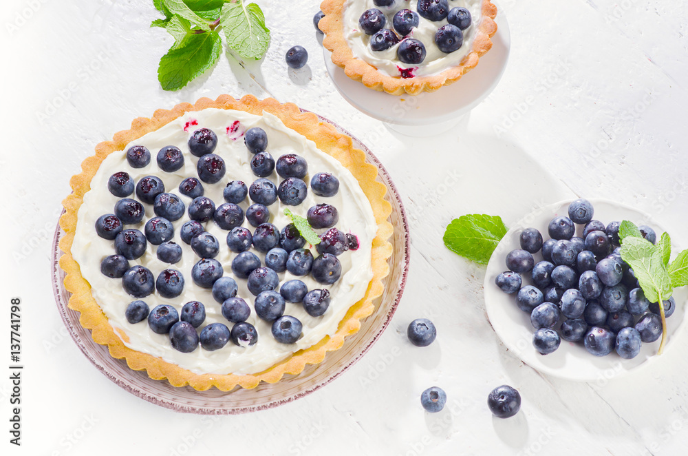 Tart with blueberries and whipped cream. Tart with blueberries and whipped cream.