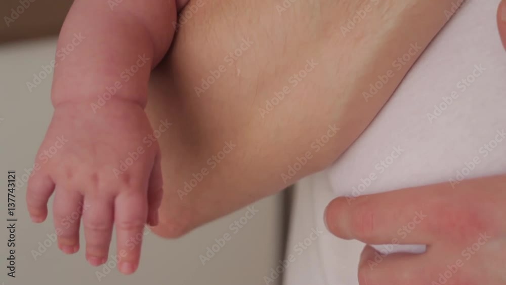 Father with new baby and begins to fall asleep Father with new baby and begins to fall asleep