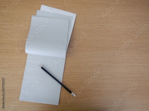 notepad open on an empty page with pencil