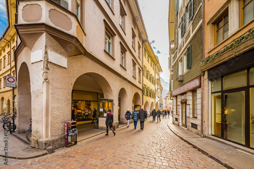 Fototapeta Naklejka Na Ścianę i Meble -  People going shopping in the streets of Bolzano