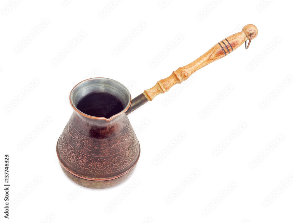 Empty copper coffee pot with a wooden handle Empty copper coffee pot with a wooden handle