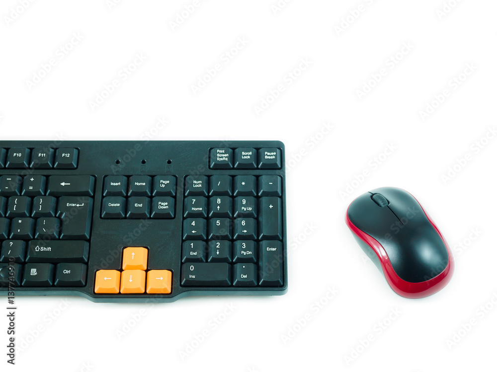 Computer black red mouse and black orange keyboard on white background Computer black red mouse and black orange keyboard on white background