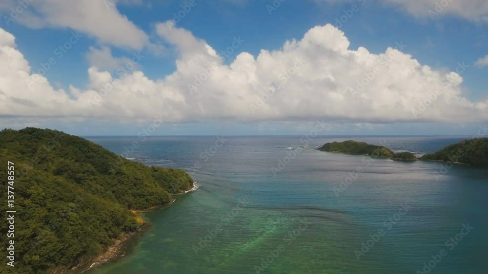 Aerial view: beach, tropical island, bay and lagoon. Tropical landscape sky, clouds and mountains rocks with rainforest. Aerial: Blue lagoon in the ocean. Aerial video.Seascape. 4K video. Travel Aerial view: beach, tropical island, bay and lagoon. Tropical landscape sky, clouds and mountains rocks with rainforest. Aerial: Blue lagoon in the ocean. Aerial video.Seascape. 4K video. Travel