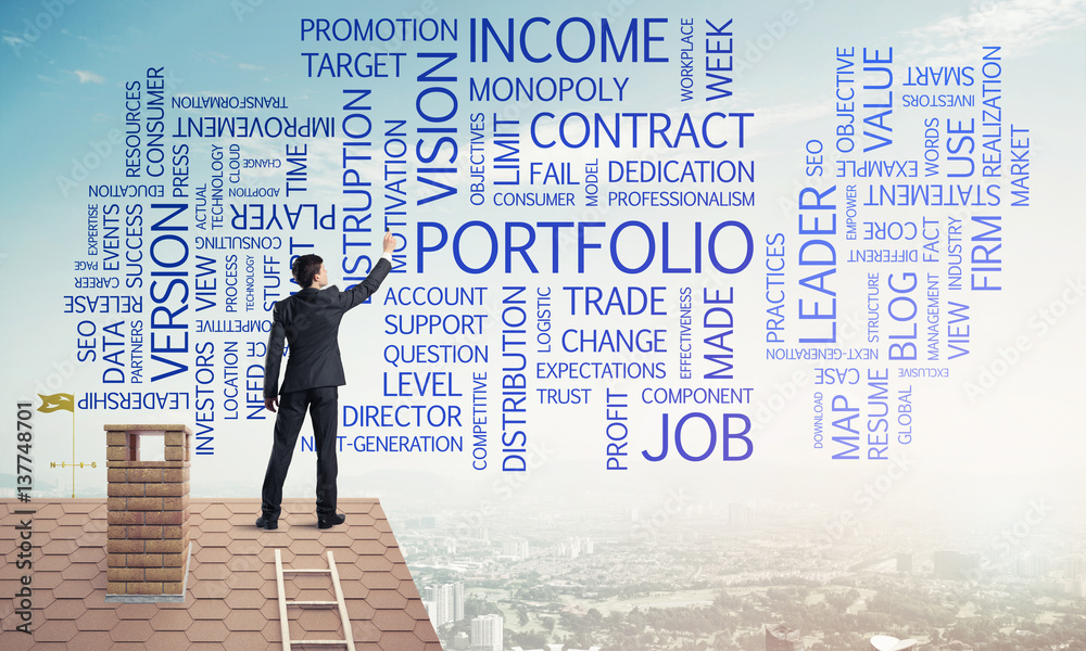 Young businessman standing on house roof and writing leadership Young businessman standing on house roof and writing leadership