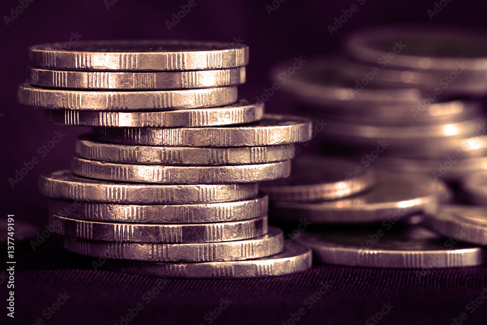 Close up silver money coin stacking on dark background Close up silver money coin stacking on dark background