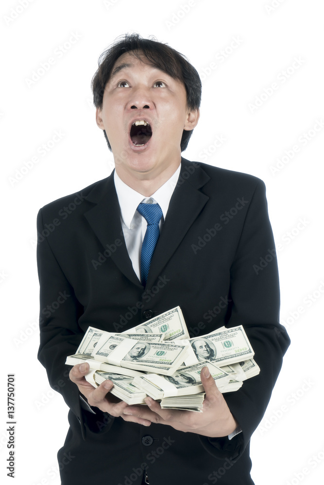 Happy businessman holding a lot of US Dollars in his hand Happy businessman holding a lot of US Dollars in his hand
