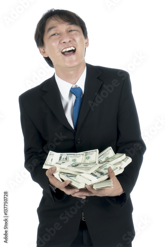 Happy businessman holding a lot of US Dollars in his hand