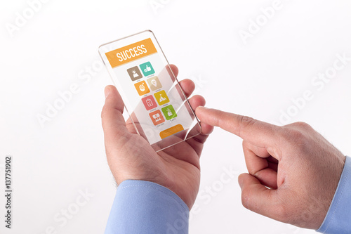 Hand Holding Transparent Smartphone with Success screen