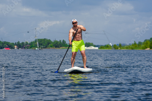 man practicing paddle board 03