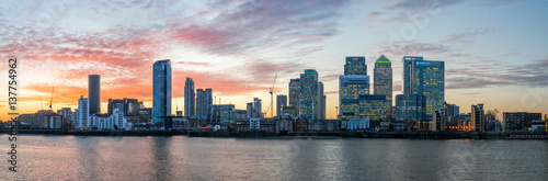Panorama of Isle of Dogs and Canary Wharf in London at sunset photo