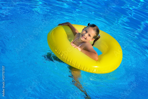 Real toddler girl relaxing at swimming pool © SuperCoolPhotography