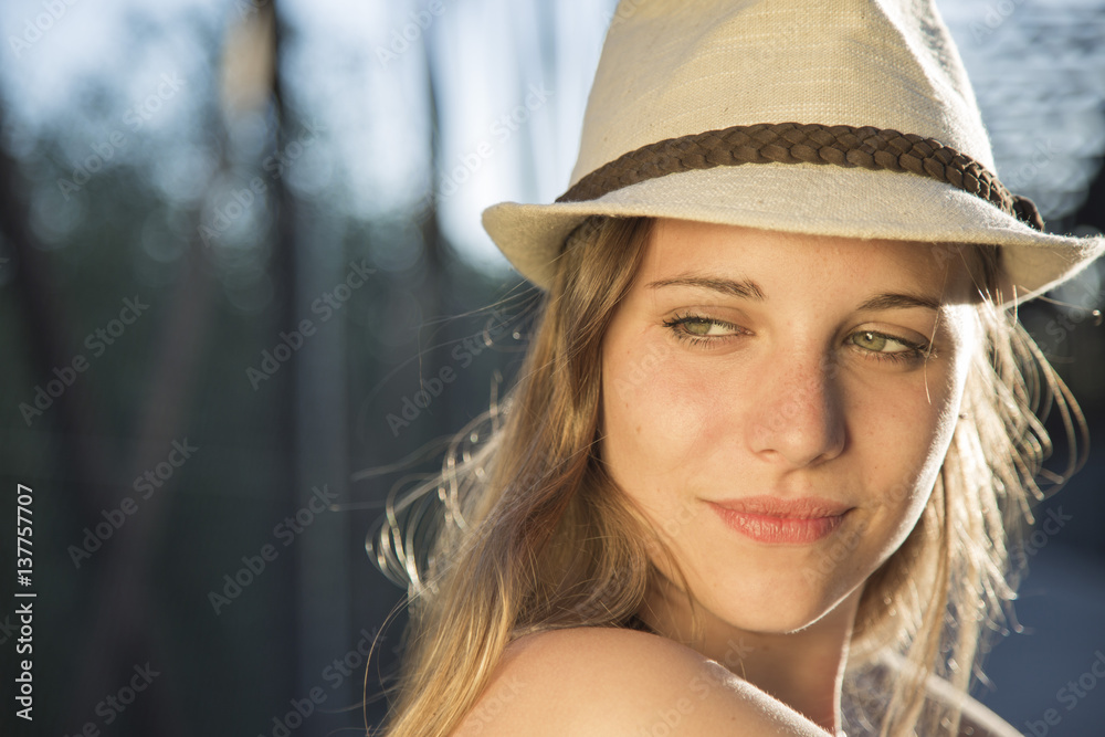 portrait of a young woman at sunset