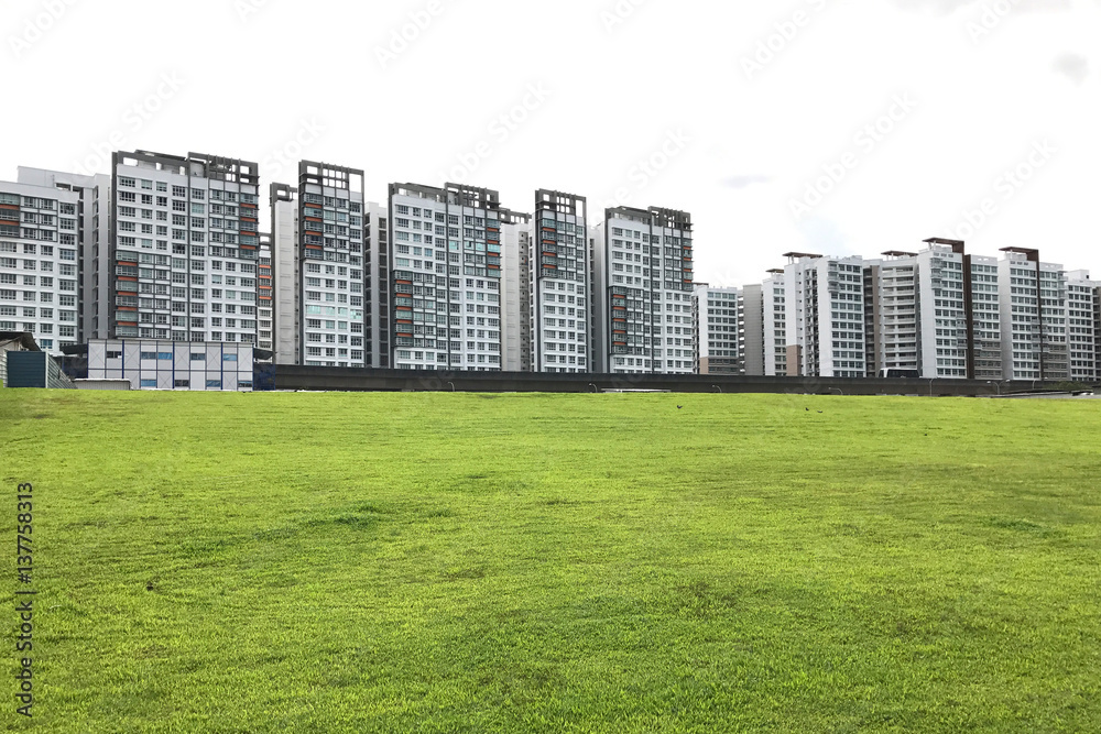 condominiuns on green grass field