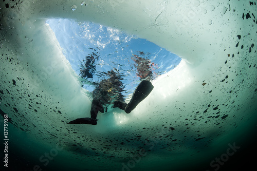Look at Ice hole from underwater 
