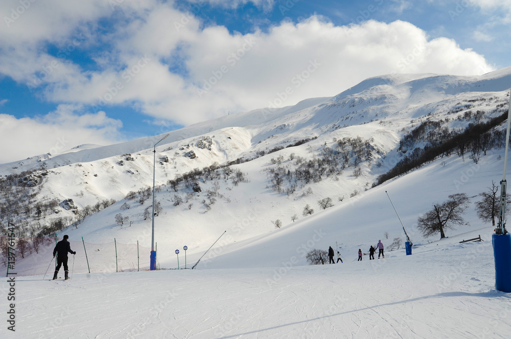 Bakuriani ski resort, Georgia Caucasus mountains 14.02.2017. Didveli ski track, cable car and blue sunny sky