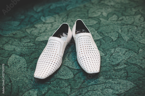 Pair of classic white leather male shoes © hdesert