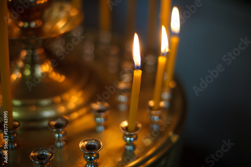 Murais de parede The candle flame in orthodox church, close up