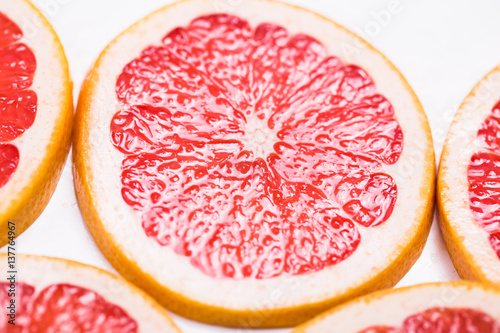 Texture of a ripe grapefruit slice, closeup