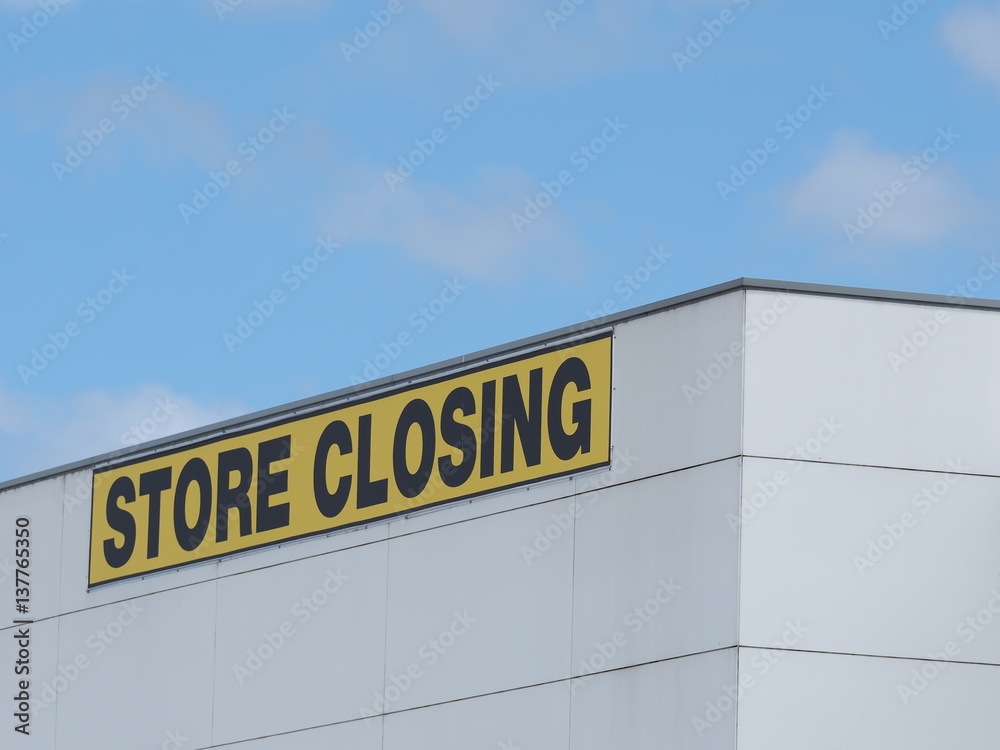 Store Closing black on yellow letters on a white cladded industrial building, Melbourne 2016 Store Closing black on yellow letters on a white cladded industrial building, Melbourne 2016